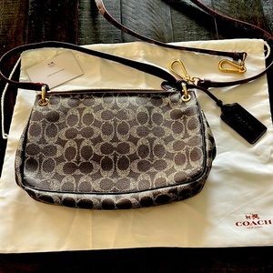 NWOT Coach purse w shoulder strap, protective sleeve & care instructions